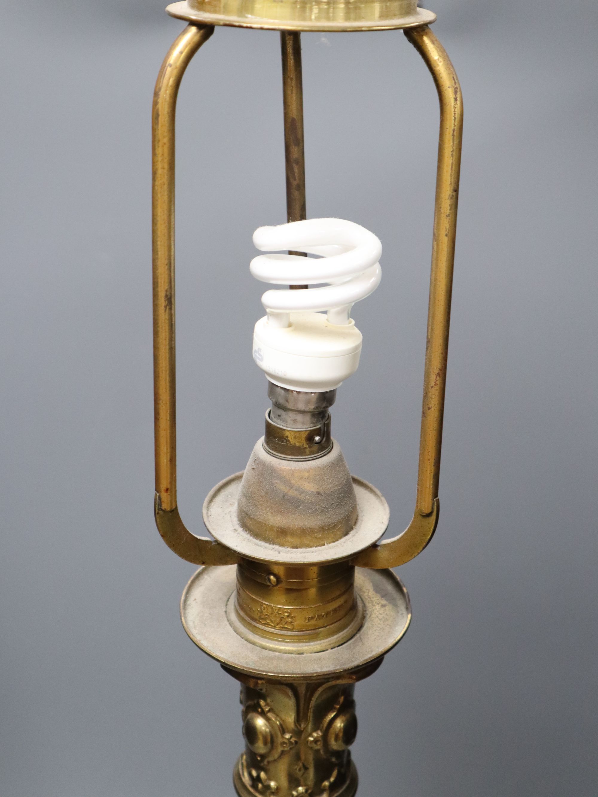A brass and ebonised patented table lamp